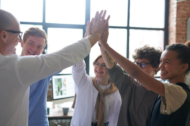 A happy team after they have saved many hours from spreadsheet automation.